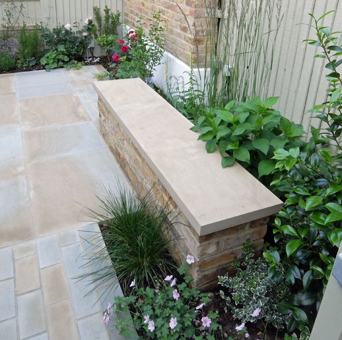 Stone and brick bench to match existing London stock wall